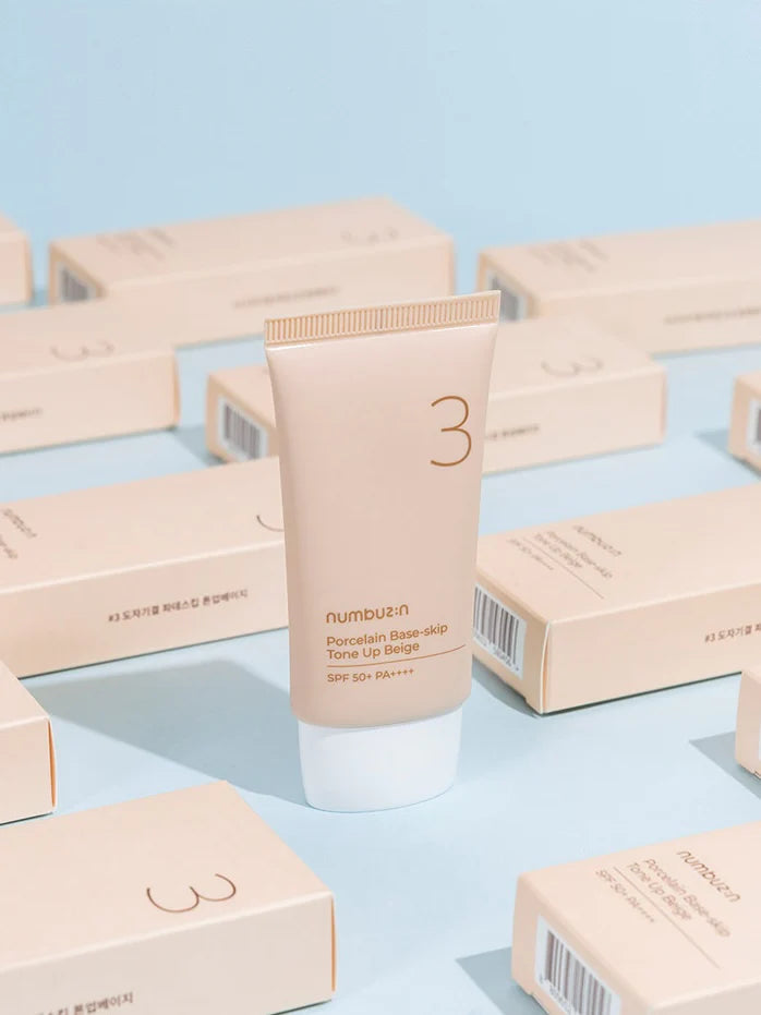 numbuzin suncream with packaging on a light blue background